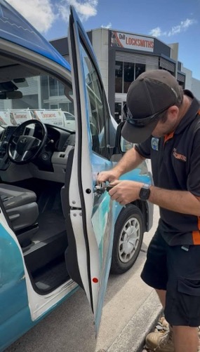 D & B Locksmiths locksmith opening a locked van door outside the Cannonvale workshop